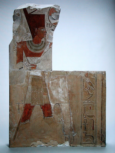 Limestone relief showing Mentuhotep II embraced by Montu