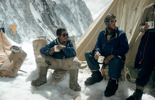 Sherpa Tenzing Norgay and Edmund Hillary drink tea in the Western Cwm