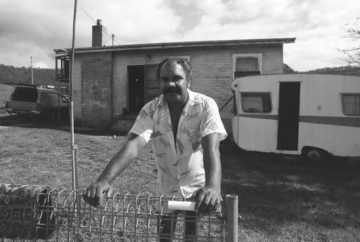 Untitled (Bellbrook NSW, man leaning on fence)