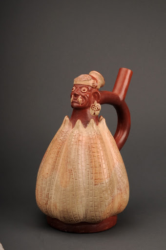 Sculptural ceramic ceremonial vessel that represents Ai Apaec emerging from a corn cob ML003291