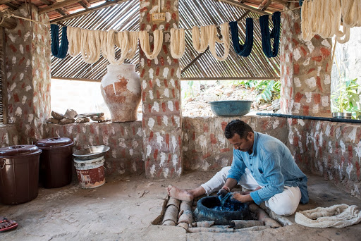 Dhabla Weaving: Shamji Vankar at work at his indigo vat