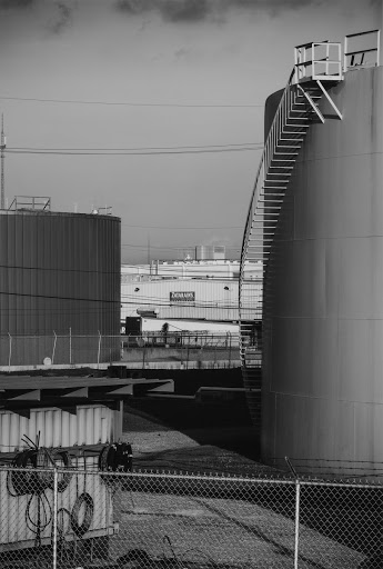 View across Stone Oil facility to Zatarain's food processing plant; from west bank levee in Gretna