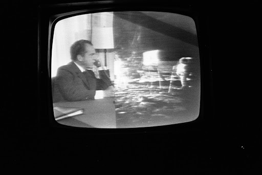 Split Screen of President Richard Nixon and the Apollo XI Astronauts on a White House Television