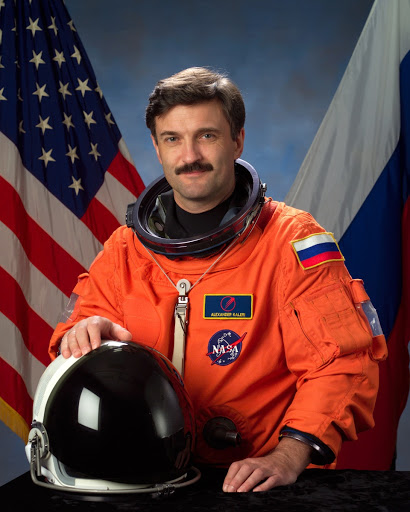 Official portrait of Cosmonaut Alexander Kaleri donned in orange LES