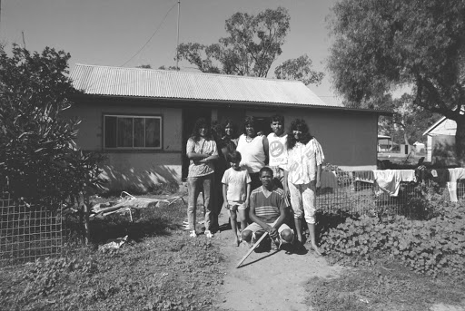 Untitled (Toomelah NSW, group standing out front of house)