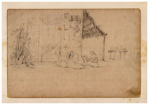 Women sitting and man lying in a hammock