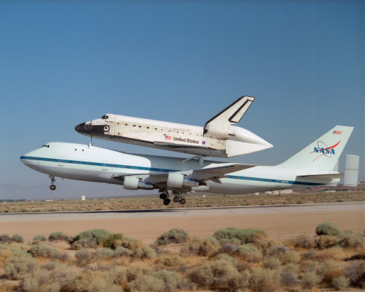 NASA's 747 Shuttle Carrier Aircraft with the Space Shuttle Discovery on top lifts off to begin its ferry flight back to the Kennedy Space Center in Florida