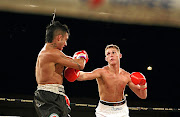 Thomas Oosthuizen, right, on his way to beating Jarred Lovett on a surprising split decision. Lovett was banned after that fight in 2009. 