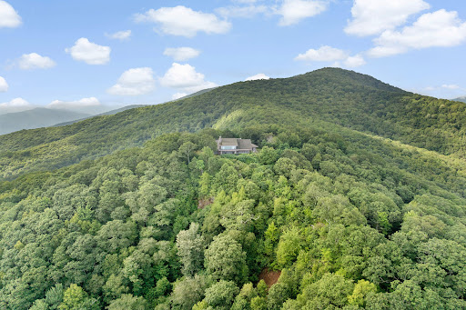 House nestled on wooded hillside in this luxury property for sale in Waynesville ($2,565,000)