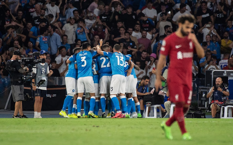 Piotr Zieliński of SSC Napoli celebrates with teammates after scoring a goal to make it 4-0 in their Uefa Champions League Group A match against Liverpool FC at Stadio Diego Armando Maradona in Naples on September 7 2022.