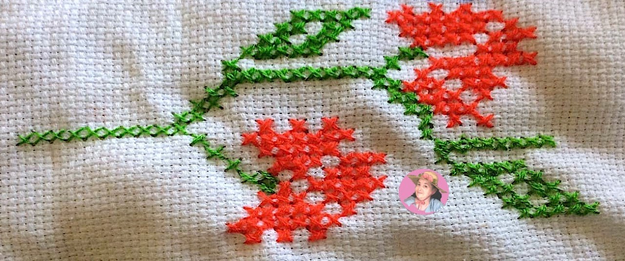 Red flowers in cross stitch 