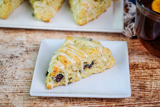 Cherry and Orange Scone on a plate.