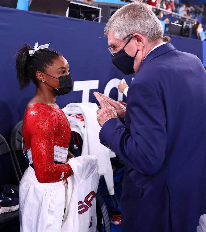 IOC President Thomas Bach with Simone Biles of the United States during the 2020 Tokyo Olympic Games