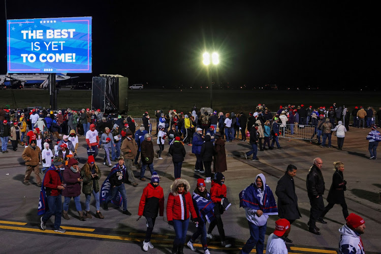 Supporters depart as US President Donald Trump boards Air Force One after a campaign rally in Montoursville, Pennsylvania on October 31, 2020.