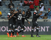 Luvuyo Memela of Orlando Pirates celebrates a goal with teammates. 