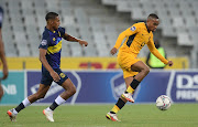 Njabulo Blom of Kaizer Chiefs is challenged by Jaeden Rhodes of Cape Town City in the DStv Premiership match at Cape Town Stadium on February 15 2022.