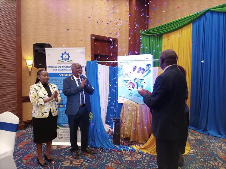 Technical, Vocational Education and Training Authority board chair Florence Indede, Kenya Journal on TVETs chief editor Bonaventure Kerre and other stakeholders from the TVETs department launch the fifth volume of the Kenya Journal on Thursday, July 7.