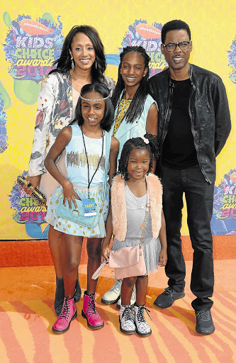 FAMILY TIES: The girl with Chris Rock, his wife, Malaak Compton-Rock, and their daughters, Lola, back, and Zahra, left