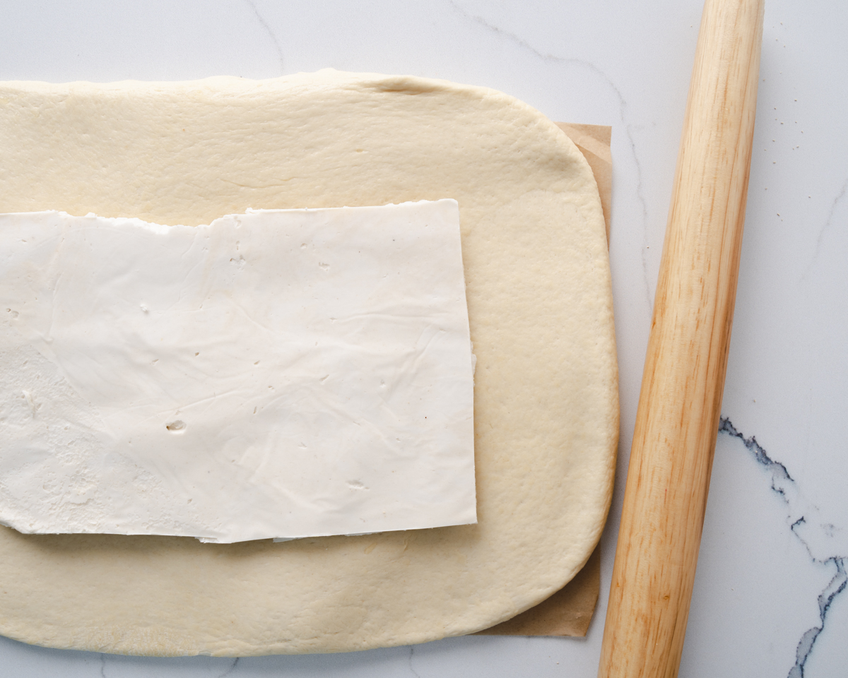 butter placed onto rectangle croissant dough