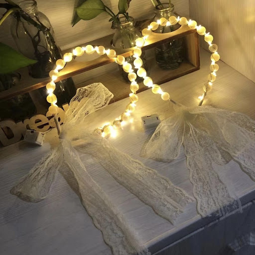 Title 11, Fairy Luminous Hair Band System features a fema...