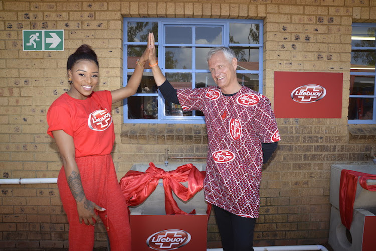 Lifebuoy brand ambassador DJ Zinhle and Bruno Witvoet, president of Unilever Africa, celebrate Global Handwashing Day.