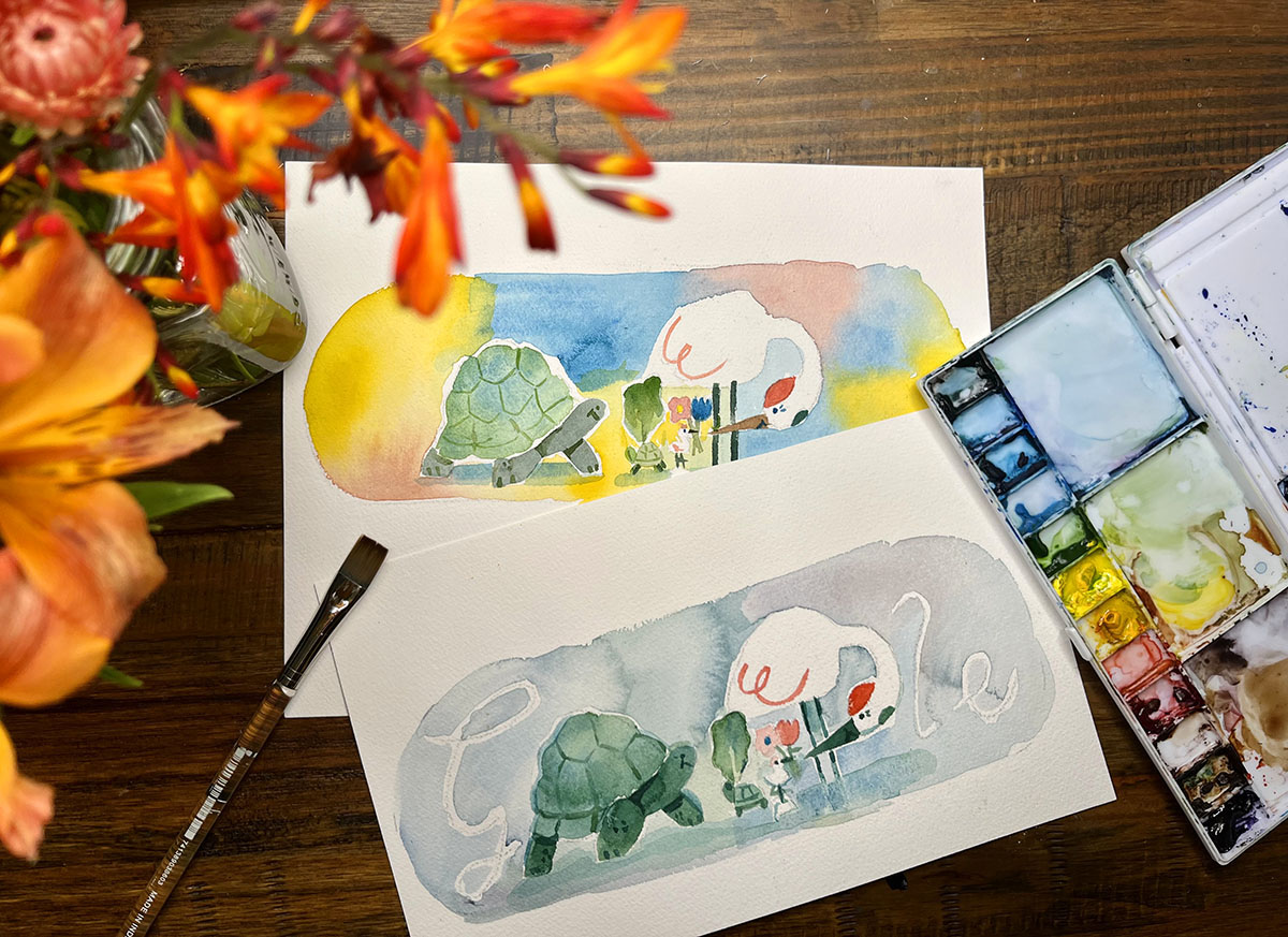 Photo of two watercolor paintings resembling the Doodle sitting on a table with flowers and watercolor paints.