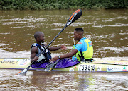 Brothers Musawenkosi and Sandile Mtolo congratulate each other after finishing second and third on the first day of the three-day Dusi Canoe Marathon at KwaXimba.