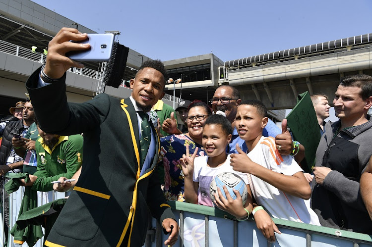 Springbok player Elton Jantjies meet fans during the South African national men's rugby team official send-off at OR Tambo International Airport on August 30, 2019 in Johannesburg, South Africa.