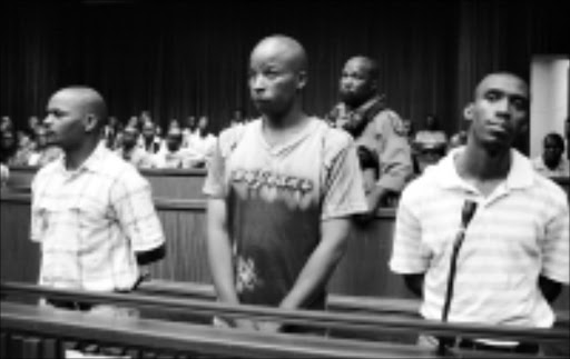 IN THE DOCK: S'fiso Mhlanga, left, Julius Gxowa and Mbuti Mabe, who are accused of murdering reggae musician Lucky Dube, pictured in the Johannesburg high court yesterday. 02/02/09. Pic. Mohau Mofokeng. © Sowetan.