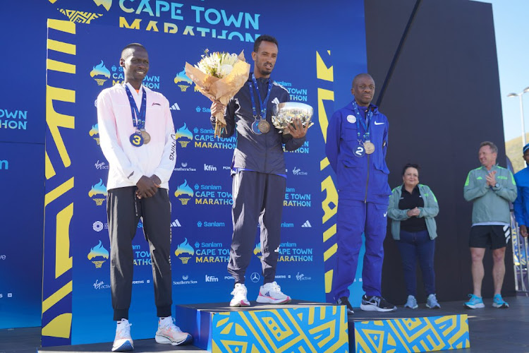 Sanlam Cape Town Marathon Elite Men's Podium (from left to right): Benard Kipkorir (third), Adane Kebede Gebre (first) and Stephen Mokoka (second).