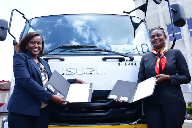 Family Bank CEO Rebecca Mbithi and Isuzu EA MD Rita Kavashe after the signing of an asset financing agreement that will see SMEs get upto 95per cent financing on Isuzu trucks and pickups