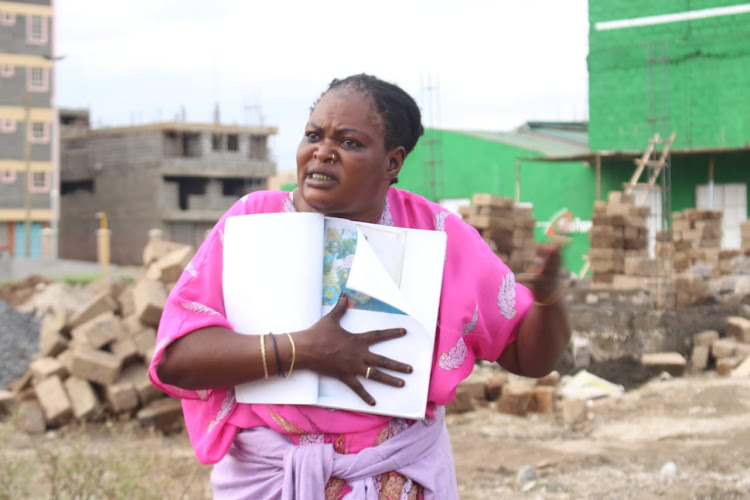 Mariam Billali protests against Njiru subcounty security officials at KCC market in Kariobangi South, Nairobi on November 16.