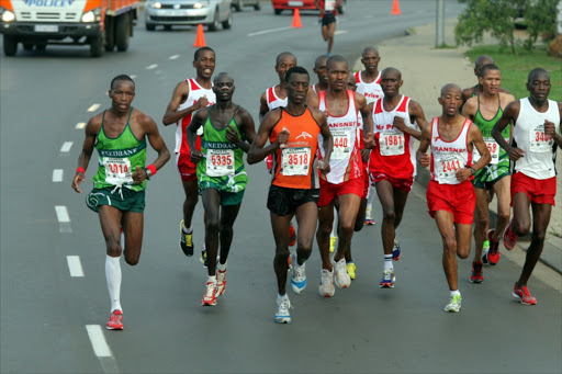 A group of athletes pound the streets of Soweto for glory during the Soweto Marathon on November 7, 2010 in Soweto, Johannesburg, South Africa.