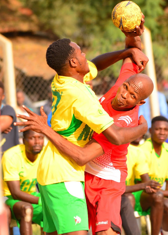 NCPB Gideon Mulwa(L) challenge Harold Mumbo of KDF during their Super Cup final match over the weekend at Kaloleni grounds.