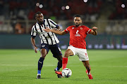 Hussein Elshahat of Al Ahly holds off the challenge of Joel Campbell of Monterrey in the Fifa Club World Cup UAE 2021 second round match between at Al Nahyan Stadium  in Abu Dhabi, United Arab Emirates on February 5 2022.