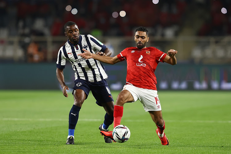 Hussein Elshahat of Al Ahly holds off the challenge of Joel Campbell of Monterrey in the Fifa Club World Cup UAE 2021 second round match between at Al Nahyan Stadium in Abu Dhabi, United Arab Emirates on February 5 2022.