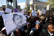 Academics and students from University of Cape Town gather outside parliament to picket against gender-based violence on September 04, 2019. 