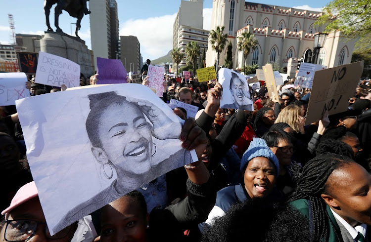 Academics and students from University of Cape Town gather outside parliament to picket against gender-based violence on September 04, 2019.