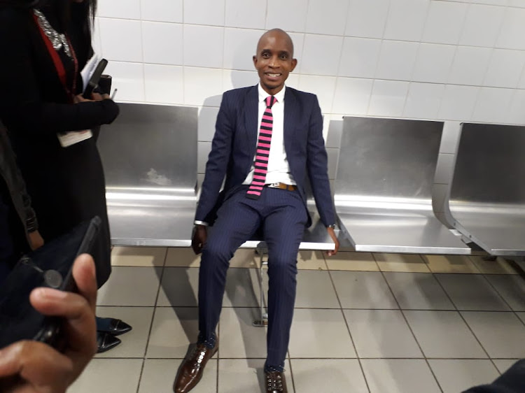 The SAHRC's Buang Jones sits on the bench where 76-year-old Martha Marais was tied up while awaiting treatment at the Mamelodi Hospital on Tuesday, June 11 2019.