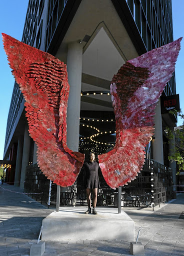 Usha Seejarim with her public art sculpture in Rosebank, Johannesburg.