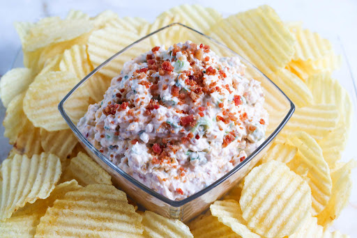 Loaded Baked Potato Dip with potato chips.