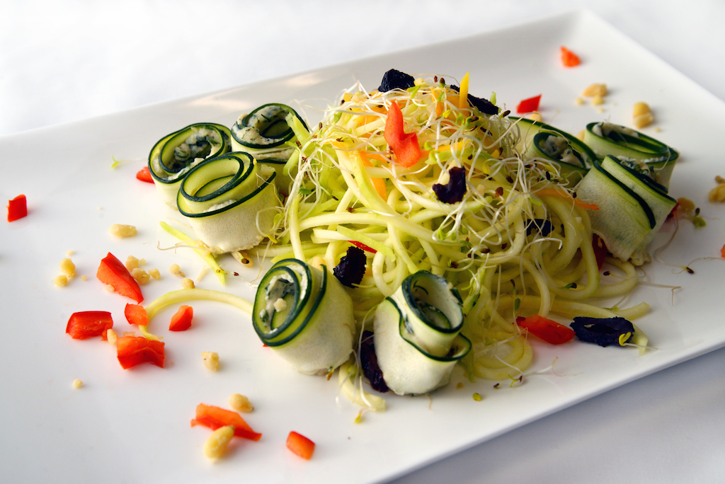 Zughetti made with zucchini noodles, garnished with bell pepper, olives, butternut squash, sprouts, dandelion cashew parmesan and with a choice of Alfredo Dill, Alfredo Mushroom or Marinara Sauce