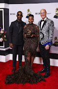 Zakes Bantwini, Nomcebo Zikode and Wouter Kellerman pose with the Grammy for Best Global music performance for 