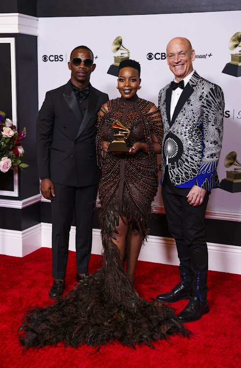 Zakes Bantwini, Nomcebo Zikode and Wouter Kellerman pose with the Grammy for Best Global music performance for "Bayethe" during the Premiere Ceremony of the 65th Annual Grammy Awards in Los Angeles, California, U.S.