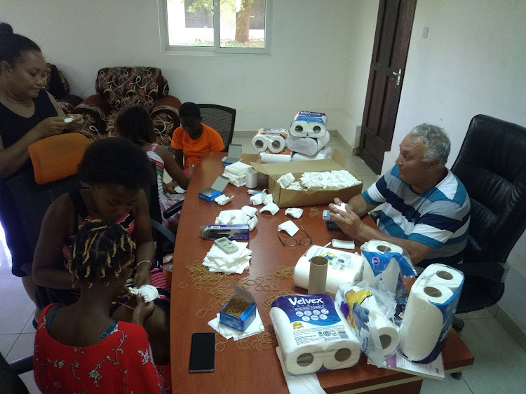 Investor Osman Elsek in his home office making the face masks.