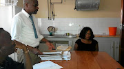 Court officials holding proceedings in a  kitchen of the Nkomazi magistrate's court. / Mandla Khoza