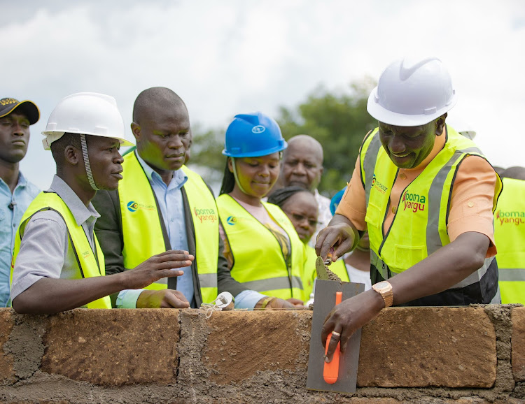 President William Ruto lays a foundation stone for Emgwen affordable housing project in Nandi county on January 16, 2024.