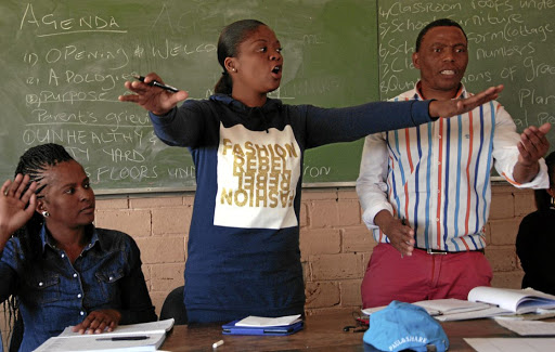 Former SGB officials at Motsaneng Primary School in Mapetla, Soweto, Mmamotseki Motseki, Sanah Seritsane and Thabo Mokoena explain issues during a meeting./SANDILE NDLOVU