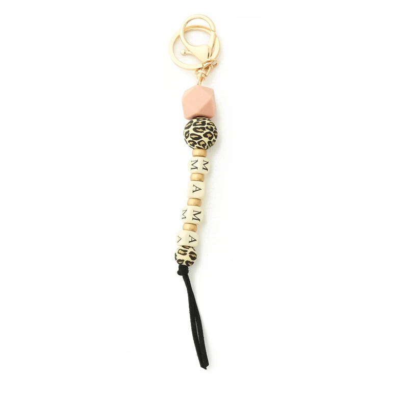 Porte-clés avec pendentif sac en silicone lettres en bois chaîne léopard pour un look original et pratique, idéal pour organiser vos clés.