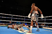 Zolani Tete towers over a poleaxed Siboniso Gonya. 